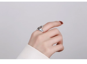 Macro detail of minimalist S925 sterling silver irregular ring with liquid metal finish
