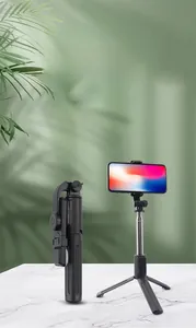 Detail view of N08-N08S bluetooth selfie stick showing folded mode and tripod setup with phone