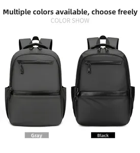 Detail of grey and black business backpacks showing waterproof fabric and side pockets