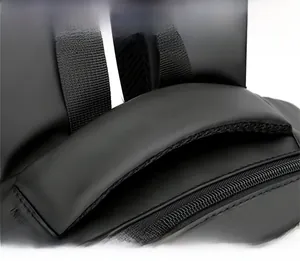 Close-up of the reinforced top handle and durable matte fabric on this black backpack