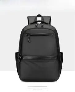 Front view of black business travel backpack showing waterproof fabric and breathable straps