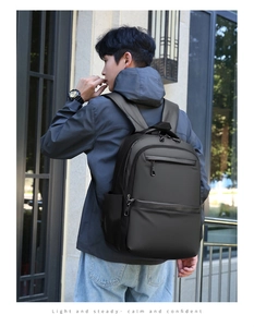 Outdoor shot of a large black business backpack with ergonomic straps for travel