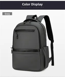 Front view of a grey business travel backpack with dual zippers and mesh padded straps