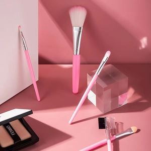 Five-piece pink makeup brush set with gradient bristles and a professional makeup palette