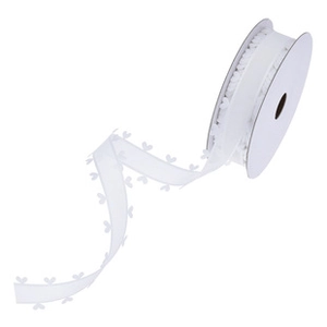 Close-up of white heart-shaped lace ribbon roll for wedding bouquets and gift wrapping
