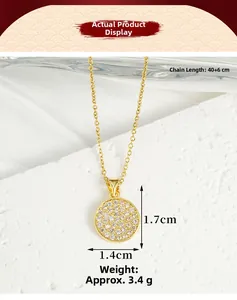 Macro shot of 18K gold plated necklace featuring a round pave-set zircon pendant on marble