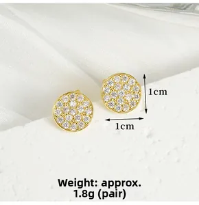 Close-up of gold-plated pave stud earrings with white zircons, 1cm diameter size detail