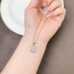 Golden round pendant necklace with multi-colored cubic zirconia stones on thin chain