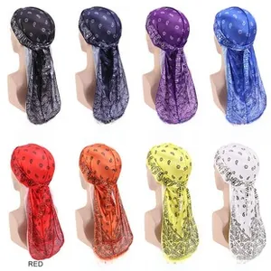 Silky durag featuring classic paisley prints in eight various colors on model displays