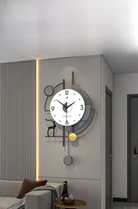 Detail of modern deer wall clock with a gold pendulum and minimalist geometric frame