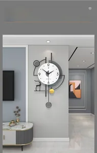 Macro detail of modern deer head wall clock with metal frame and pendulum for home decor