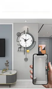 Detail of modern wall clock with stag silhouette, 3D numbers and gold accents