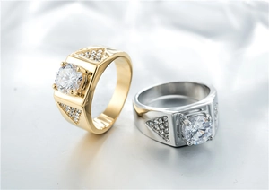 Close-up of gold and silver rings featuring a large round zircon stone in four-prong setting