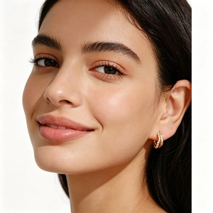 Detailed close-up of a model wearing double-layered S925 silver hoop earrings with pave diamonds