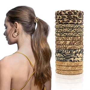 Close-up of animal print hair scrunchies set featuring leopard and zebra patterns