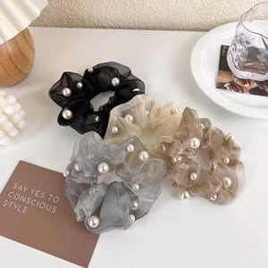 Set of four organza hair scrunchies in neutral colors with elegant pearl embellishments