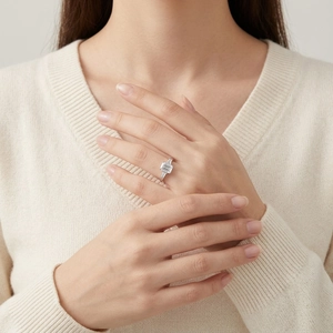 Elegant S925 sterling silver ring with emerald cut moissanite stone on female hand