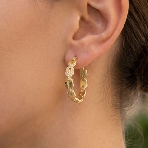 Gold chain link hoop earrings with cubic zirconia pavé detailing in a geometric C-shape