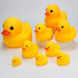 Classic yellow rubber duck bath toy set with red beak, 9 pieces on white platform
