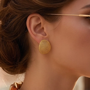 French luxury 18K gold plated mesh texture dome stud earrings worn by a model