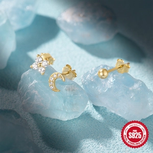 Detailed shot of S925 sterling silver gold stud earrings set on blue quartz stone