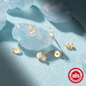Detailed shot of S925 sterling silver earrings with marquise, round zircon and pearl