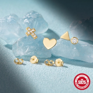 Set of four geometric gold S925 sterling silver studs on ice cubes with sparkling zircons