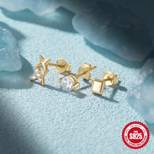 Detail of S925 sterling silver gold-plated stud set with star, round, and square designs