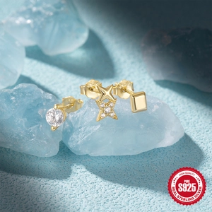 Detail of S925 sterling silver stud earring set with zircon star and geometric shapes