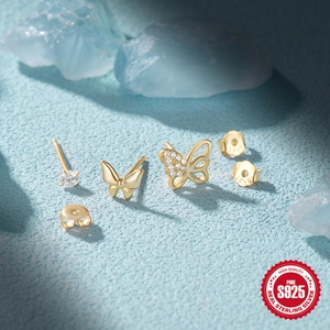 Detailed macro view of S925 sterling silver butterfly stud earrings set with zircon stones