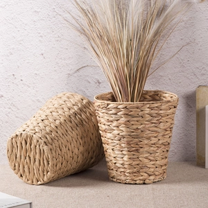 Set of two handmade woven seagrass storage baskets in natural color for home decor