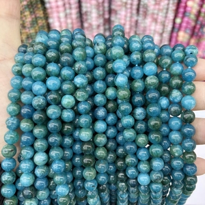 Macro shot of natural deep blue chalcedony round beads for DIY jewelry making