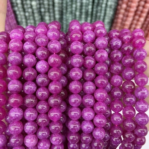 Detailed close-up of vibrant purple chalcedony beads with natural crystal textures