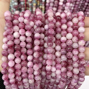 Close-up of pink chalcedony round beads with natural texture for DIY jewelry making