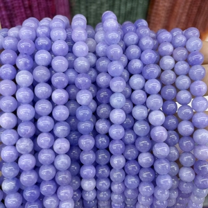 Macro shot of polished lavender purple chalcedony round beads for DIY jewelry making