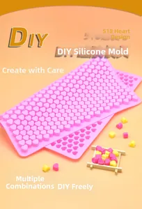 Detailed view of pink 55-cavity heart silicone mold for DIY baking and chocolate making