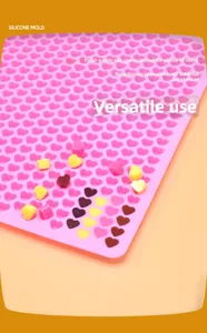 Macro detail of pink heart silicone mold with multi-cavity design for chocolates and candies