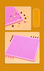 Detail view of pink silicone heart mold for mini chocolate and candy baking