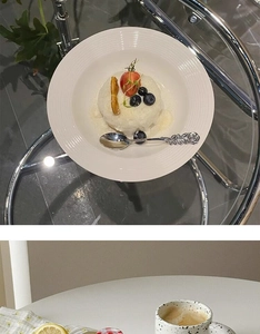 Close-up of white relief ceramic plate with black polka dot mug and rose handle spoon