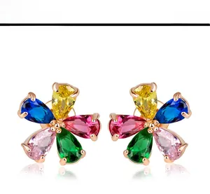 Detail view of colorful five-petal flower earrings with multi-color zircon stones