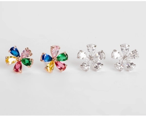 Close-up of multicolored and white zircon flower earrings with pear-shaped stones