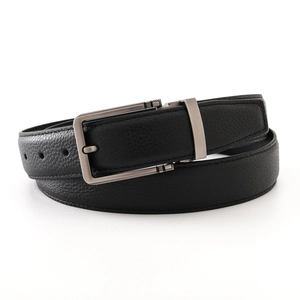 Detailed macro of men's black leather belt with lychee texture and brushed metal buckle