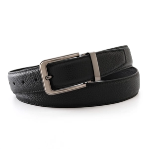 Detail of black lychee grain leather belt with brushed metal silver buckle for men