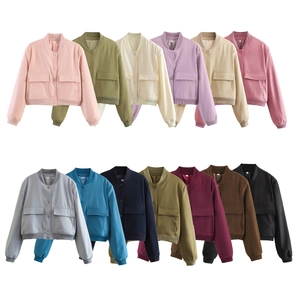 Flat lay display of cropped bomber jackets in 13 various colors with utility pockets