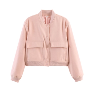 Detailed macro view of pink bomber jacket with large pockets and ribbed cuffs