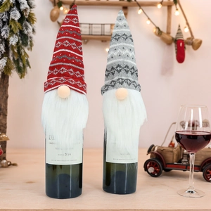 Knitted Christmas gnome wine bottle covers set in red and grey for festive holiday decor
