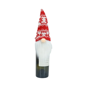 Detail of red and white knitted gnome wine bottle topper with a long white beard