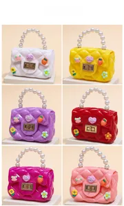Detailed view of six colors of mini jelly bags with pearl handles and cute charms