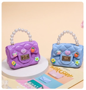 Detailed view of mini jelly bags with pearl handles and colorful cartoon 3D resin charms