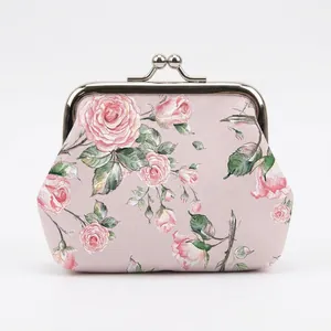 Detail of vintage floral coin purse featuring a silver kiss-lock and rose print